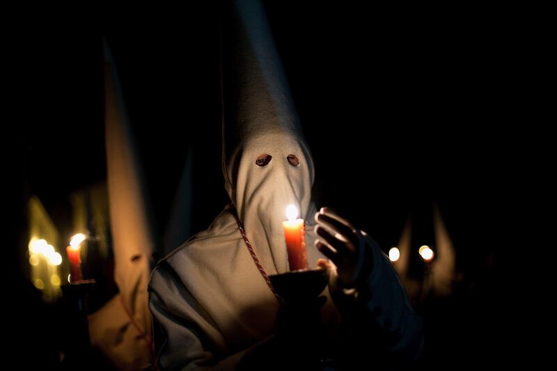 ZAMORA, SPAIN - MARCH 29:  A penitent protects the flame of a candle during the Holy Week procession of the Cofradia Jesus Yacente on March 29, 2013 in Zamora, Spain. Easter week is traditionally celebrated with processions in most Spanish towns.  (Photo by Pablo Blazquez Dominguez/Getty Images) *** Local Caption ***  164857973.jpg