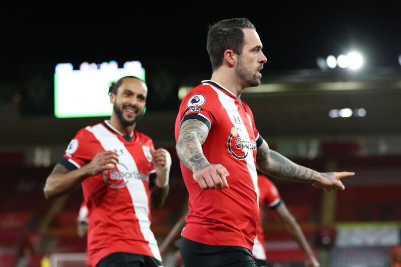 Southampton's English striker Danny Ings (R) celebrates after scoring the opening goal of the English Premier League football match between Southampton and Liverpool at St Mary's Stadium in Southampton, southern England on January 4, 2021. RESTRICTED TO EDITORIAL USE. No use with unauthorized audio, video, data, fixture lists, club/league logos or 'live' services. Online in-match use limited to 120 images. An additional 40 images may be used in extra time. No video emulation. Social media in-match use limited to 120 images. An additional 40 images may be used in extra time. No use in betting publications, games or single club/league/player publications.
 / AFP / POOL / Naomi Baker / RESTRICTED TO EDITORIAL USE. No use with unauthorized audio, video, data, fixture lists, club/league logos or 'live' services. Online in-match use limited to 120 images. An additional 40 images may be used in extra time. No video emulation. Social media in-match use limited to 120 images. An additional 40 images may be used in extra time. No use in betting publications, games or single club/league/player publications.
