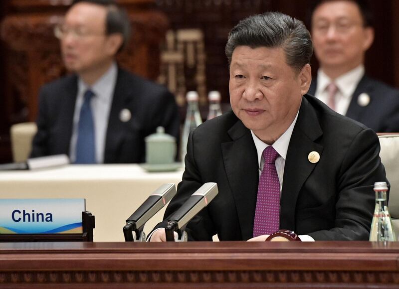 China's President Xi Jinping attends a roundtable summit session on the final day of the Belt and Road Forum in Beijing on April 27, 2019. Chinese President Xi Jinping urged dozens of world leaders on April 27 to reject protectionism and invited more countries to participate in his global infrastructure project after seeking to ease concerns surrounding the programme. / AFP / Sputnik / Aleksey Nikolskyi
