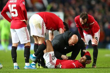 Manchester United striker Marcus Rashford gets treatment during the FA Cup replay against Wolves. Getty