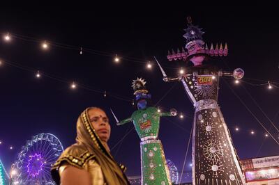 A woman watches a play based on the life of Lord Ram during Navratri celebrations in Delhi. Reuters