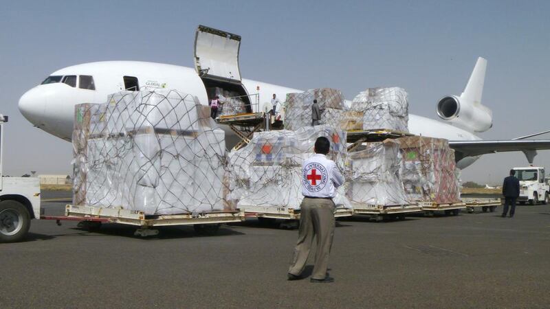 International Committee of the Red Cross workers unload a cargo plane carrying humanitarian relief supplies for civilians affected by the Saudi-led air campaign against Houthi rebels, at the airport in Sanaa on April 11, 2015. Hani Mohammed/AP Photo