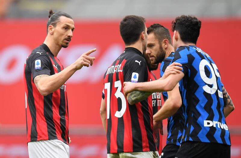AC Milan's Zlatan Ibrahimovic, left, argues with Alessandro Bastoni of Inter. Reuters