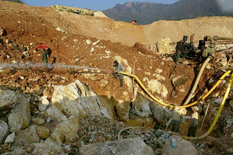 Men use a water cannon to search for rubies at the open pit of mine in Mogok. Total ruby production in Myanmar were over 19 million kilograms in the fiscal year 2012- 2013. Soe Zeya Tun / Reuters
