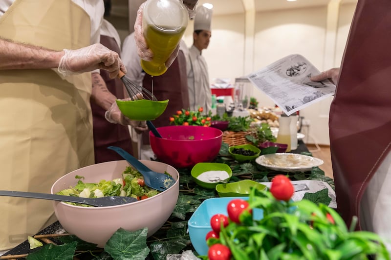 Prisoners, assisted by chefs, put together recipes at Dubai Central Jail
