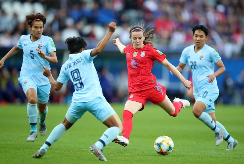 Rose Lavelle, centre, of USA in action against Warunee Phetwiset of Thailand. EPA