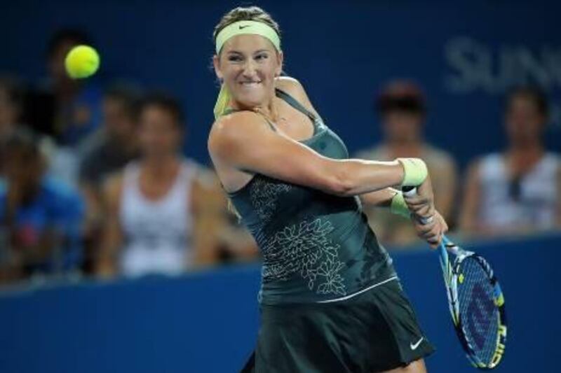 Victoria Azarenka of Belarus plays a backhand during her match against Sabine Lisicki of Germany on day four of the Brisbane International in Brisbane, Australia.