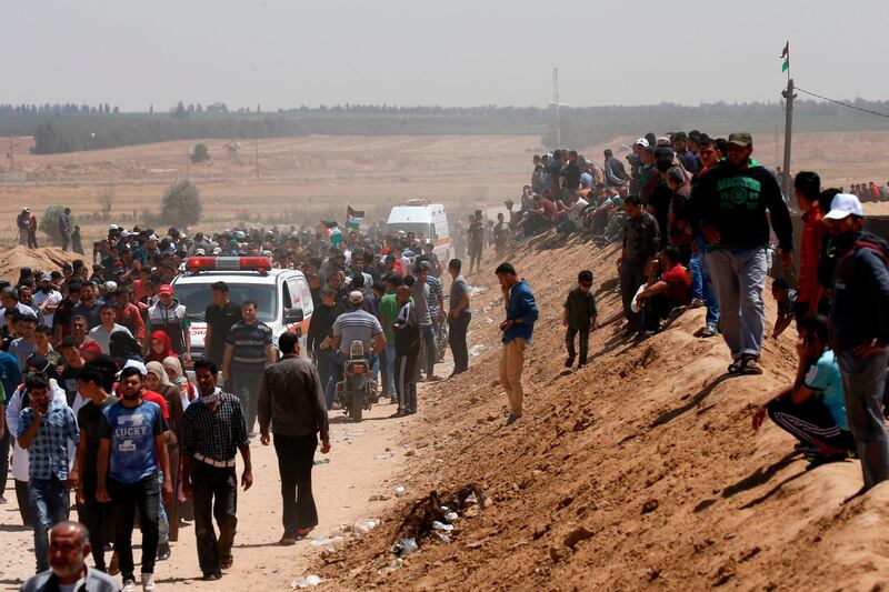 Palestinian demonstrators gather east of Khan Yunis in the southern Gaza Strip, during a protest marking 71th anniversary of 'Nakba' AFP