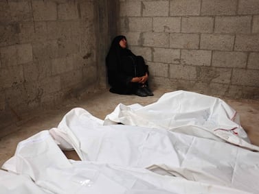 TOPSHOT - A Palestinian mourns relatives killed in Israeli bombardment, at the al-Najjar hospital in Rafah in the southern Gaza Strip, on April 29, 2024 amid the ongoing conflict between Israel and the Palestinian militant group Hamas.  (Photo by AFP)