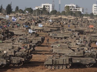 Israeli military vehicles gathered near the border fence with the Gaza Strip, at an undisclosed location in southern Israel, 09 May 2024.  On 07 May, Israel said that its troops began an operation targeting Hamas militants and infrastructure within specific areas of eastern Rafah, taking operational control of the Gazan side of the Rafah crossing.  The United States on 08 May confirmed the decision to pause a shipment of 'high payload munitions' to Israel.  More than 34,900 Palestinians and over 1,455 Israelis have been killed, according to the Palestinian Health Ministry and the Israel Defense Forces (IDF), since Hamas militants launched an attack against Israel from the Gaza Strip on 07 October 2023, and the Israeli operations in Gaza and the West Bank which followed it.   EPA / ABIR SULTAN