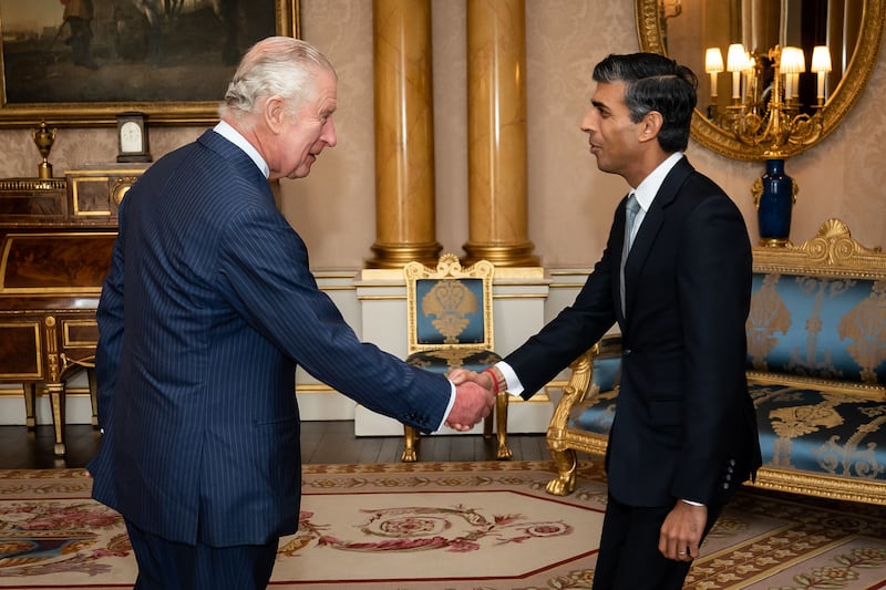 King Charles welcomes Rishi Sunak during an audience at Buckingham Palace, where he invited the newly elected leader of the Conservative Party to become Prime Minister and form a new government in October 2022