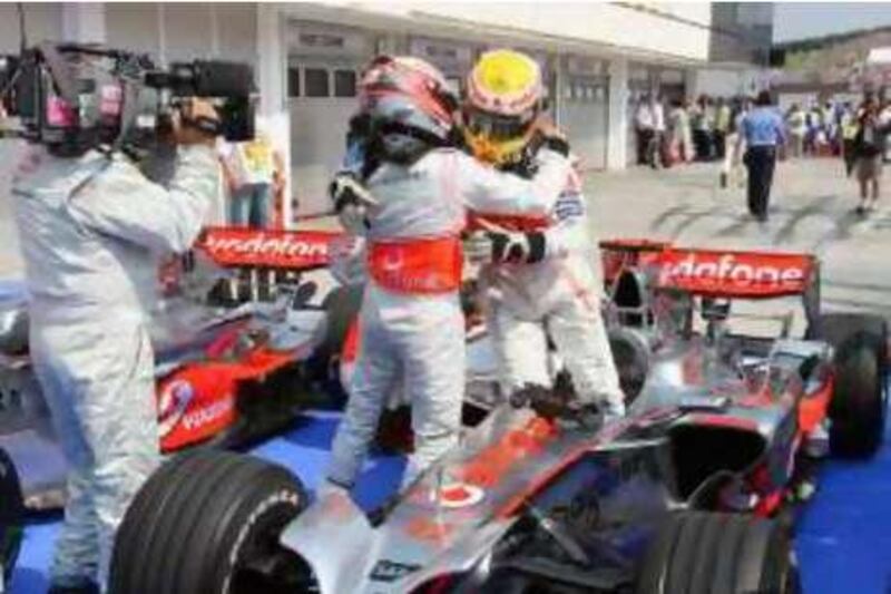 BUDAPEST, HUNGARY - AUGUST 02:  Lewis Hamilton (R) of Great Britain and McLaren Mercedces celebrates in parc ferme with team mate Heikki Kovalainen of Finland after claiming pole position  during qualifying for the Hungarian Formula One Grand Prix at the Hungaroring on August 2, 2008, in Budapest, Hungary.  (Photo by Mark Thompson/Getty Images) *** Local Caption ***  GYI0055413837.jpg