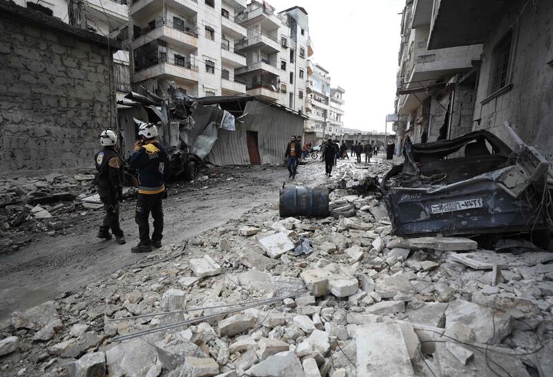 Syrian rescuers known as the White Helmets walk amidst the rubble scattered across a street following a reported regime air strike in the town of Ariha in the Idlib province on January 5, 2020, killing at least 5 civilians. Jihadist-run Idlib has come under mounting bombardment in recent weeks, forcing tens of thousands to flee their homes in the region of some three million people.
The Damascus government has repeatedly vowed to take back control of Idlib, which is run by Hayat Tahrir al-Sham, a group dominated by Syria's former Al-Qaeda affiliate. / AFP / Omar HAJ KADOUR
