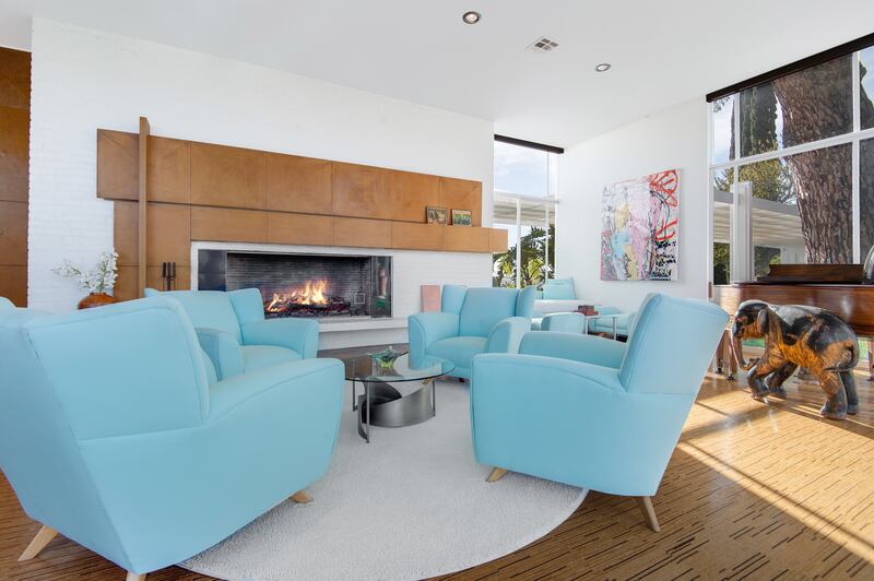 The living area is fitted with a modern fireplace.