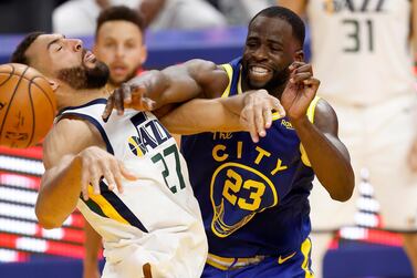 Utah Jazz centre Rudy Gobert draws a foul from Golden State Warriors forward Draymond Green. EPA