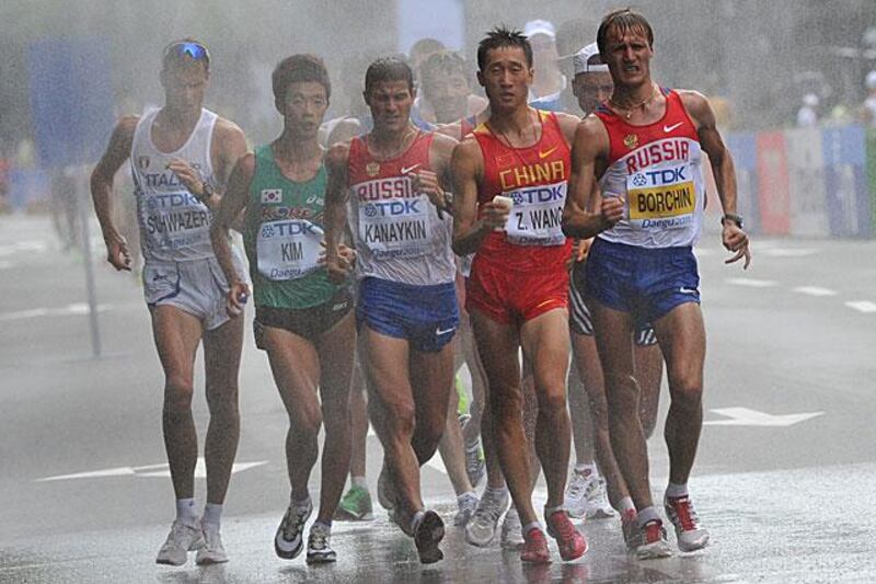 The leaders of the men's 20km walk, including the eventual winner Valeriy Borchin of Russia, pass through a "spray station" during their gruelling event on the streets of Daegu.

Kim Jae-hwan / AFP