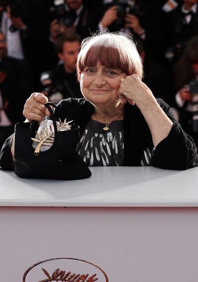 FILE - In this Sunday, May 24, 2015 file picture, director Agnes Varda holds the Honorary Palme d'Or award during a photo call following the awards ceremony at the 68th international film festival, Cannes, southern France. Filmmaker Agnes Varda, a central figure of the French New Wave who later won the Golden Lion at the Venice Film Festival, has died. She was 90. (AP Photo/Thibault Camus, File)