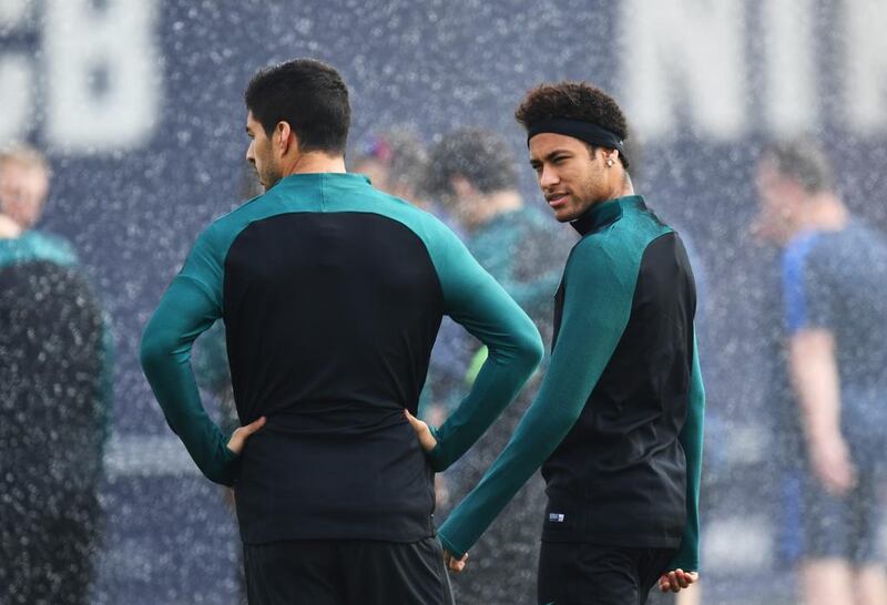 Luis Suarez and Neymar look on during the training session. David Ramos / Getty Images