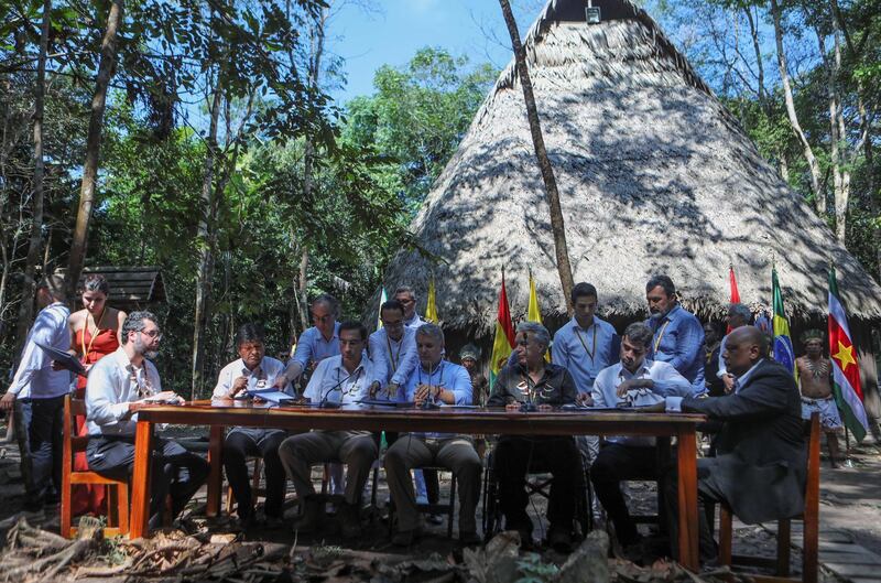 Brazil’s Foreign Minister Ernesto Araujo, Bolivia’s President Evo Morales, Peru’s President Martin Vizcarra, Colombia’s President Ivan Duque, Ecuador’s President Lenin Moreno and Suriname's Vice President Michael Ashwin Adhin sign a pact for the Amazon during the Presidential Summit for the Amazon, in Leticia, Colombia September 6, 2019. REUTERS/Luisa Gonzalez