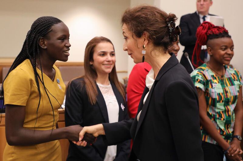 French UNESCO general manager Audrey Azoulay, right, meets with girls during the "Education for Girl" meeting at the UN headquarter.  AFP