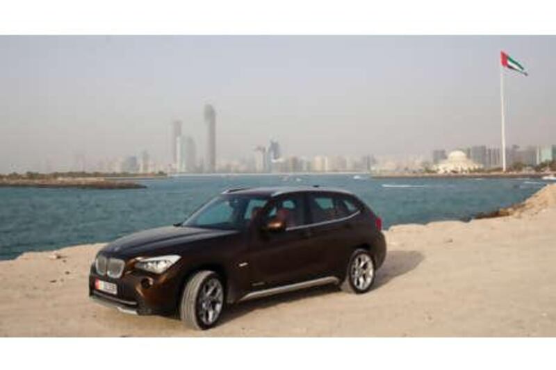 The white slashes along the top of the headlights of the BMW X1  are reminiscent of David Bowie's eye make-up circa 1972.