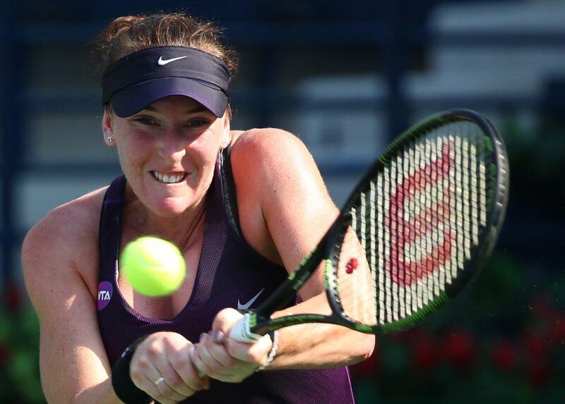 Madison Brengle of the US returns the ball to Russian Ekaterina Makarova during their WTA tennis match on the first day of the Dubai Duty Free Tennis Championships on February 16, 2016 in Dubai. / AFP / MARWAN NAAMANI