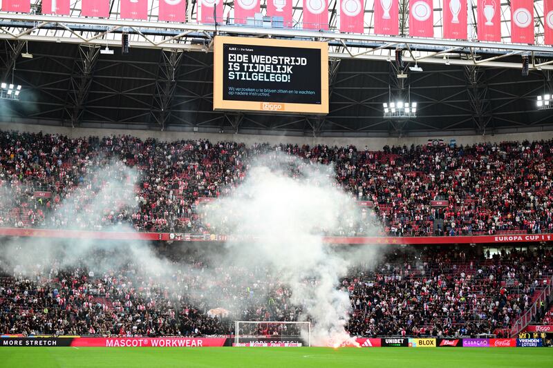 The match is abandoned for the second time due to flares on the pitch. EPA