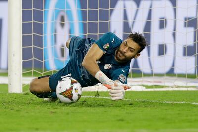 Egypt's goalkeeper Mohammed Abu Gabal dives to save during a penalty shootout against Cameroon in the Africa Cup of Nations semi-final at the Olembe stadium in Yaounde, Cameroon. AP