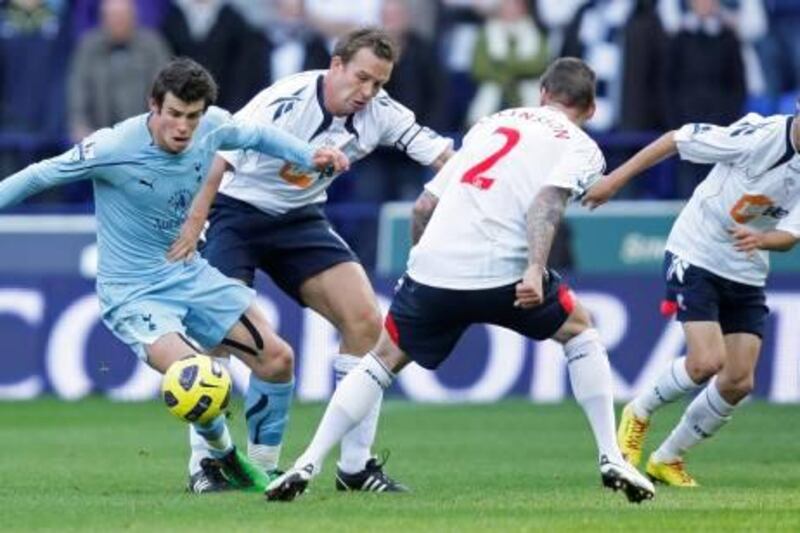 Football - Bolton Wanderers v Tottenham Hotspur Barclays Premier League  - The Reebok Stadium - 6/11/10
Bolton Wanderers Kevin Davies challenges Gareth Bale
Mandatory Credit: Action Images / Jason Cairnduff
Livepic
NO ONLINE/INTERNET USE WITHOUT A LICENCE FROM THE FOOTBALL DATA CO LTD. FOR LICENCE ENQUIRIES PLEASE TELEPHONE +44 (0) 207 864 9000.