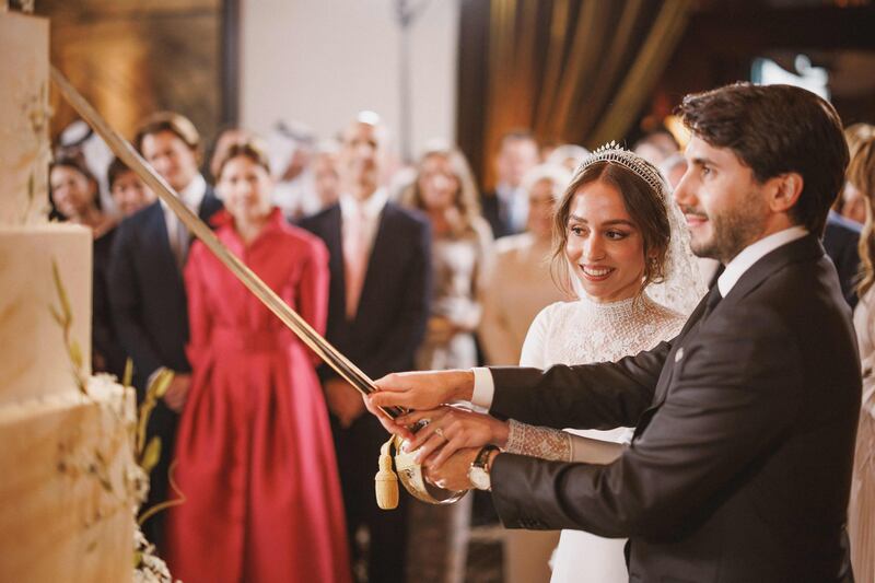 The couple cut the cake following the ceremony. AFP