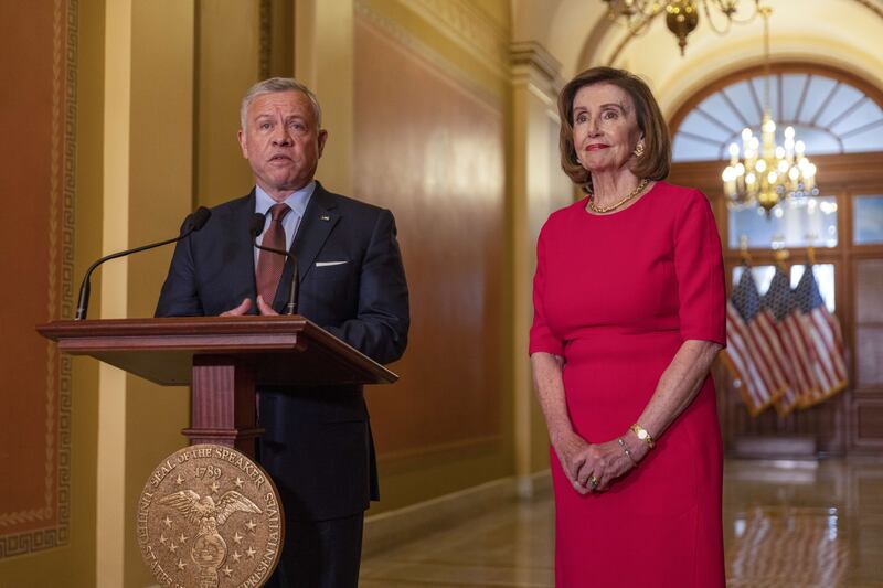 King Abdullah speaks at a press conference alongside Ms Pelosi at the US Capitol.  Getty Images / AFP
