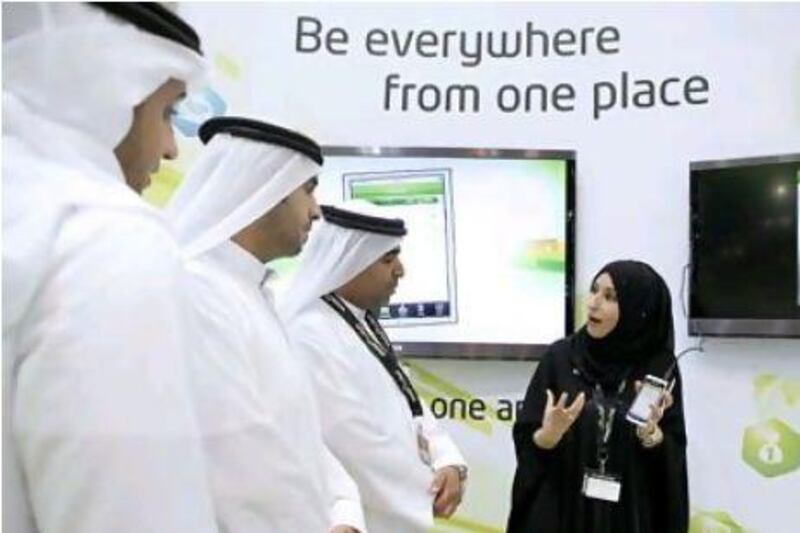 Maha Muraish, the online channels and portals director at Etisalat, demonstrates the ePlus mobile application.