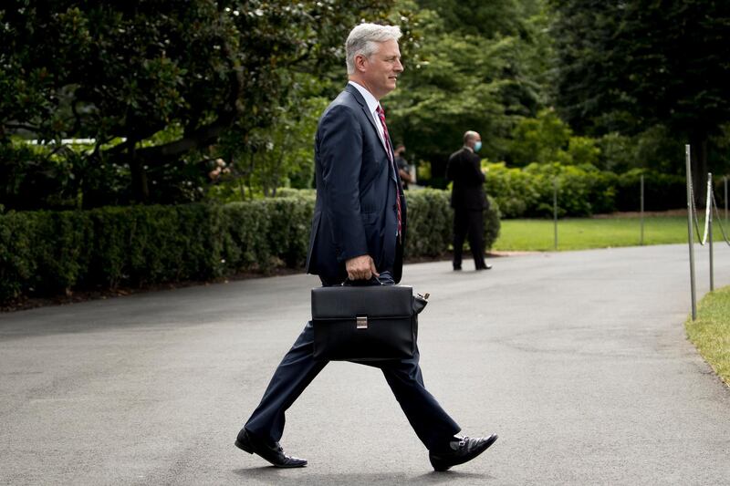 White House national security adviser Robert O'Brien walks South Lawn of the White House in Washington, Friday, July 10, 2020, before boarding Marine One to join President Donald Trump for a short trip to Andrews Air Force Base, Md., and then on to Florida. (AP Photo/Andrew Harnik)