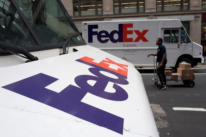 FILE - This Aug. 22, 2017  file photo shows FedEx trucks parked in New York. Companies with ties to the National Rifle Association have been dealing with increasing public pressure since the Parkland, Florida massacre that killed 17 people earlier this month. FedEx is the latest company prompted to make a statement, saying it â€œopposes assault rifles being in the hands of civiliansâ€ but strongly supports the right to own a firearm. The delivery service, which offers discounts to NRA members, said it is sticking with the organization. (AP Photo/Mark Lennihan, File)