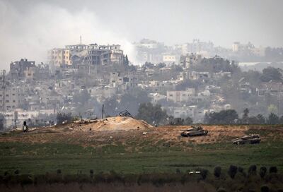 Israeli Merkava tanks take position along the border with the Gaza Strip. AFP