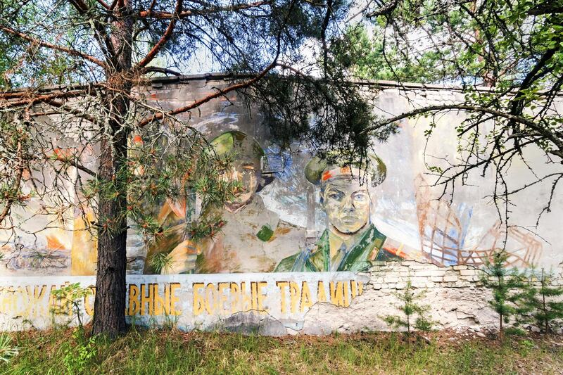 A Soviet era mural sits on the side of an abandoned building near the Duga Radar. Bloomberg