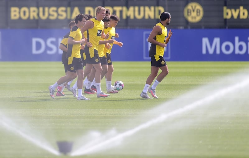 Dortmund players go through their warm-up routine on Monday. EPA