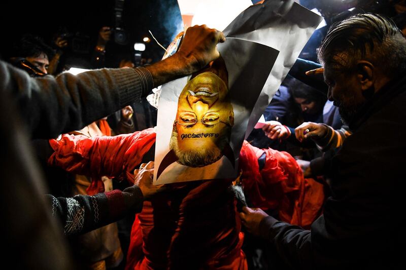 Indian Hindu activists burn an effigy of Chief Minister of Kerala Pinarayi Vijayan during a demonstration over two women entering the Sabarimala Ayyapa temple in the southern state of Kerala, in New Delhi. Clashes broke out in southern India for a second day on January 3 as Hindu hardliners went on the rampage, seeking to enforce a general shutdown in protest at two women entering one of the country's holiest temples. A day after violence among rival groups and with police left one man dead and 15 people injured, authorities said that 266 protestors had been arrested across the state of Kerala.  AFP