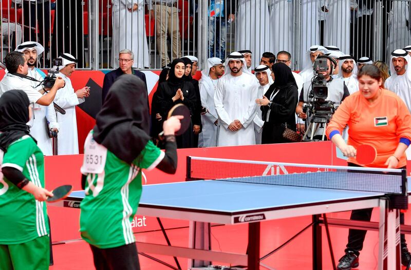 Sheikh Hamdan and  Shamma Al Mazrui watch a table tennis match. Wam
