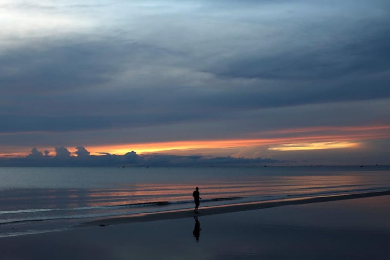 A man jogs at daybreak on a beach in Hua Hin, Thailand. Jorge Silva / Reuters