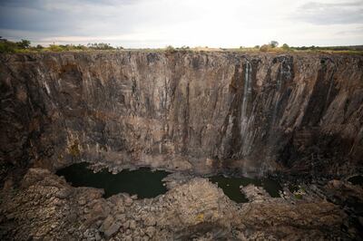 Dry cliffs are seen following a prolonged drought at Victoria Falls, Zimbabwe, December 4, 2019. Picture taken December 4, 2019. REUTERS/Mike Hutchings     TPX IMAGES OF THE DAY