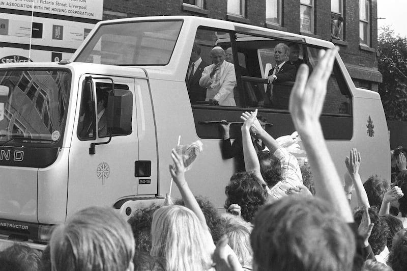 Pope John Paul II arriving at Liverpool Anglican Church, England in his Popemobile on May 30, 1982. (AP Photo/Dave Caulkin)