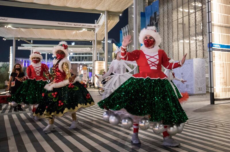 Performers with their Christmas costume entertain crowd at the  EXPO 2020 Dubai.  Leslie Pableo for The National