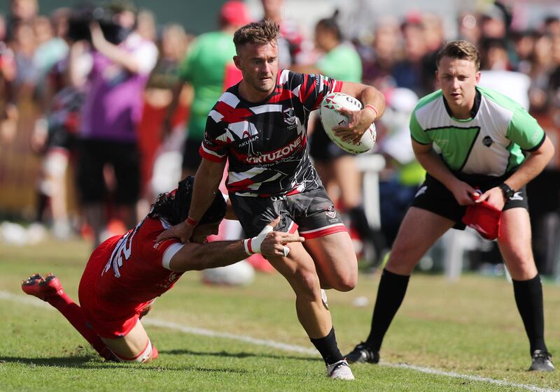 Exiles' Conor Kennedy breaks the Tigers defence.