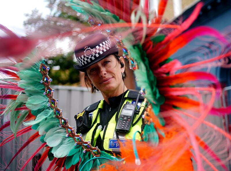 A police officer attends the carnival. PA