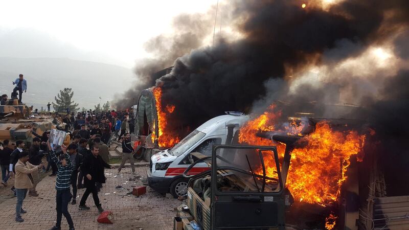 A smoke rises from vehicles after protesters stormed a Turkish military camp near Dohuk, Iraq January 26, 2019.  REUTERS/Stringer  NO RESALES. NO ARCHIVES