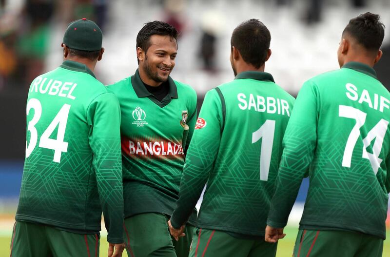 Bangladesh's Shakib Al Hasan, second left, and teammates celebrate winning the Cricket World Cup match between West Indies and Bangladesh at The Taunton County Ground, Taunton, south west England, Monday June 17, 2019. (David Davies/PA via AP)