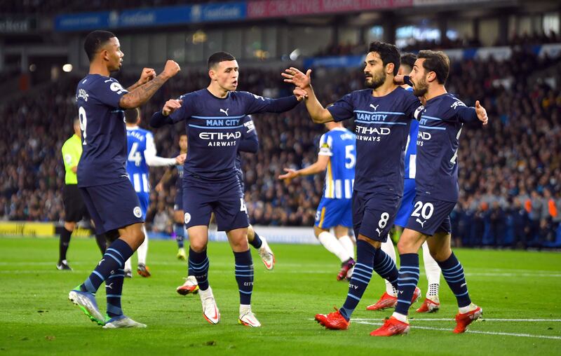 Manchester City's Ilkay Gundogan celebrates scoring their first goal with teammates. Reuters