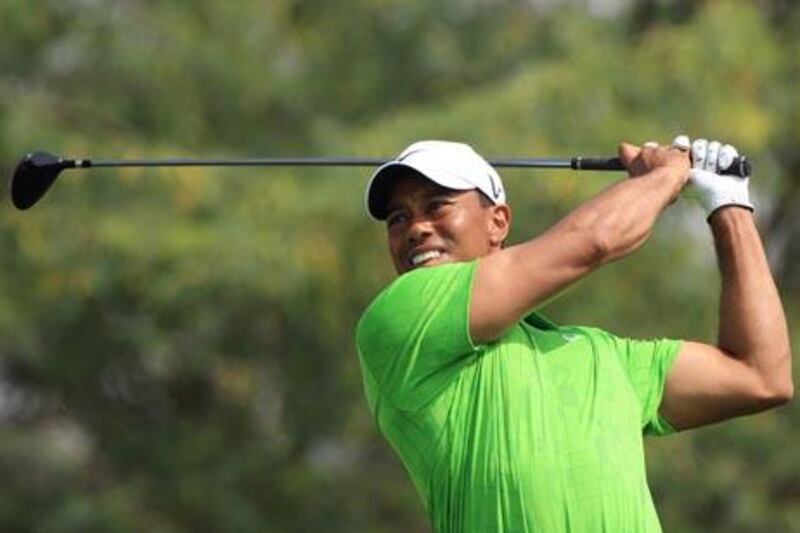 ABU DHABI - 11FEB2011 - Tiger Woods of the USA plays a shot during the second round of the Dubai Desert Classic golf tournament at Emirates Golf Club yesterday in Dubai. Ravindranath K / The National 