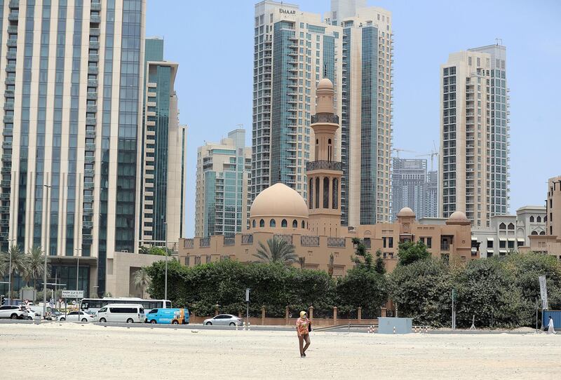 Street photography. A women walks through the sand in Downtown Dubai on April 29th, 2021. Chris Whiteoak / The National. 
Reporter: N/A for News